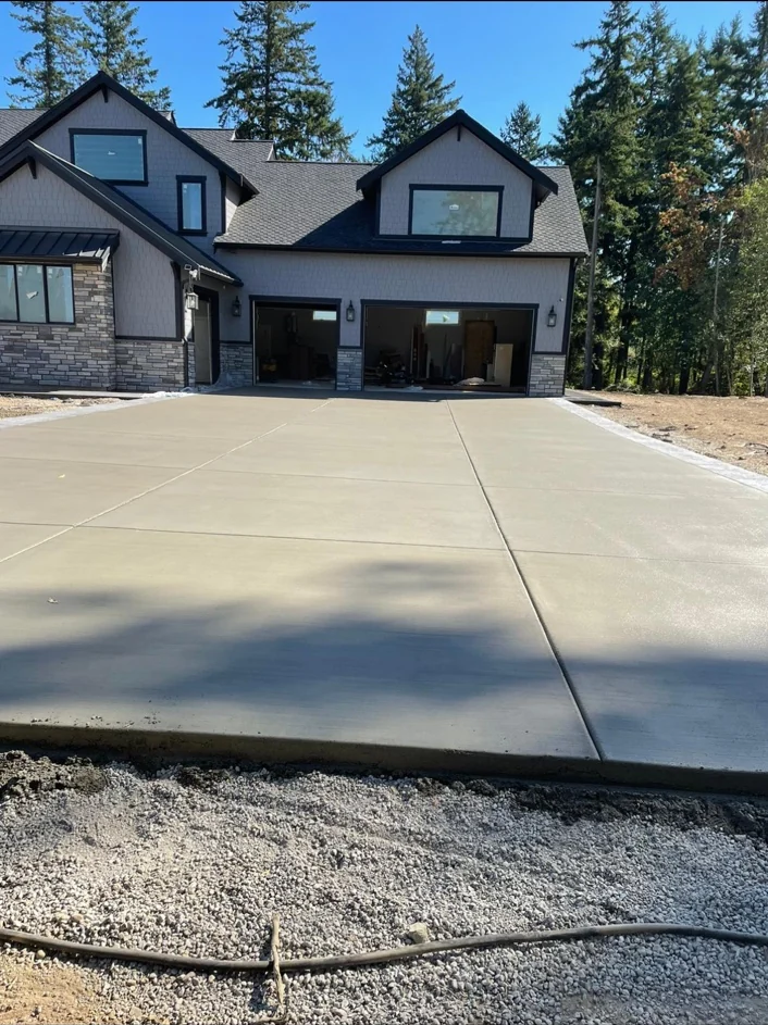 RCM Concrete driveway leading to a two-car garage